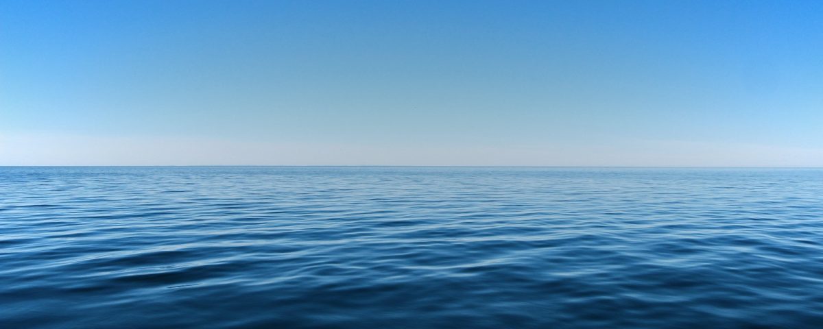 blue ocean water under blue sky during daytime
